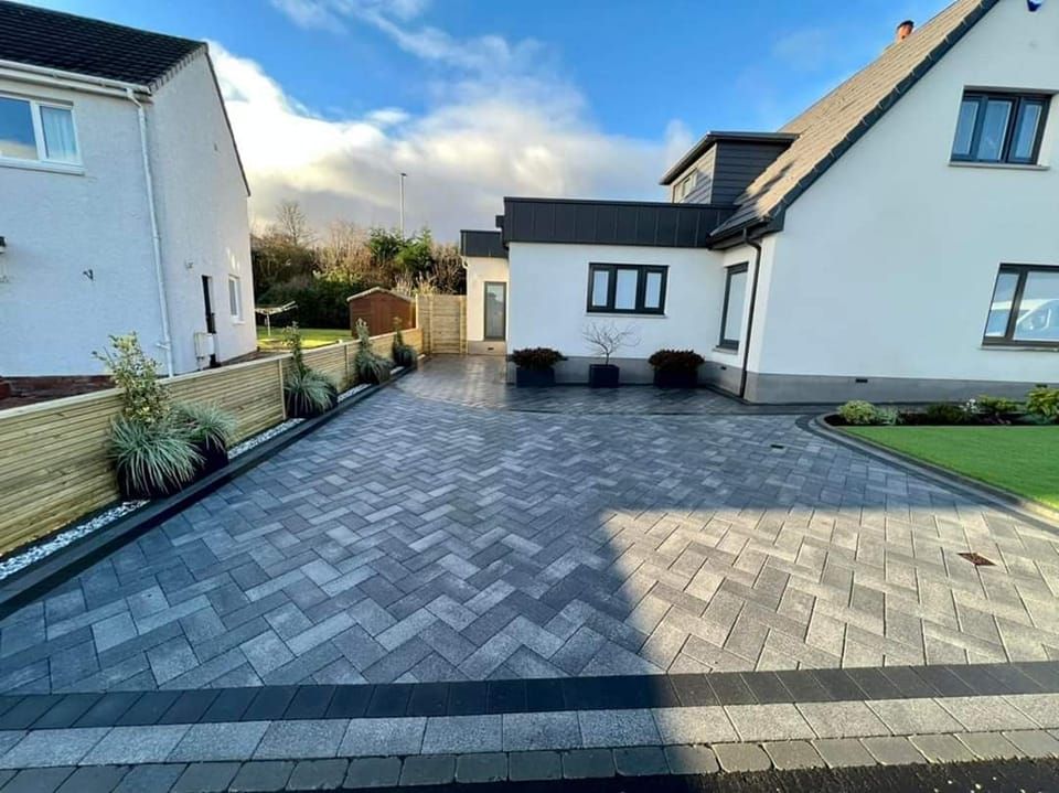 Grey block paving with a contrasting charcoal border