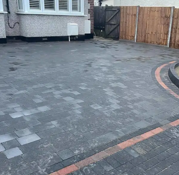 Grey block paved driveway with a contrasting border