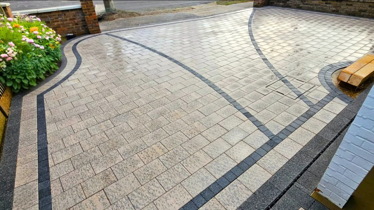Completed block paved driveway with sweeping charcoal borders