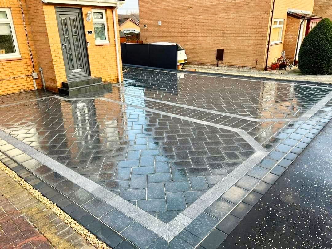Grey paved driveway showing block pattern and edging