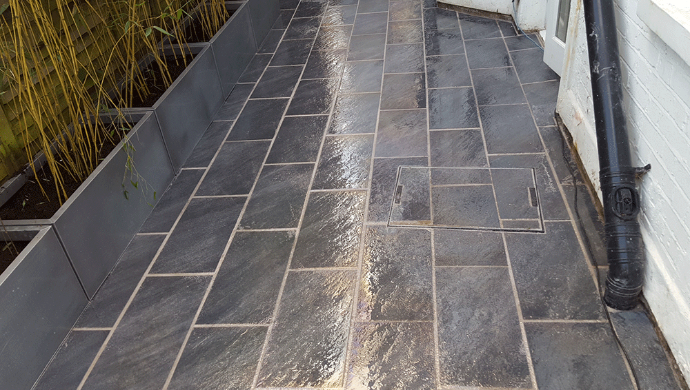 Completed grey stone patio with neatly aligned joints